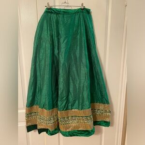 Green lehenga choli with gold embroidery. Includes matching dupatta